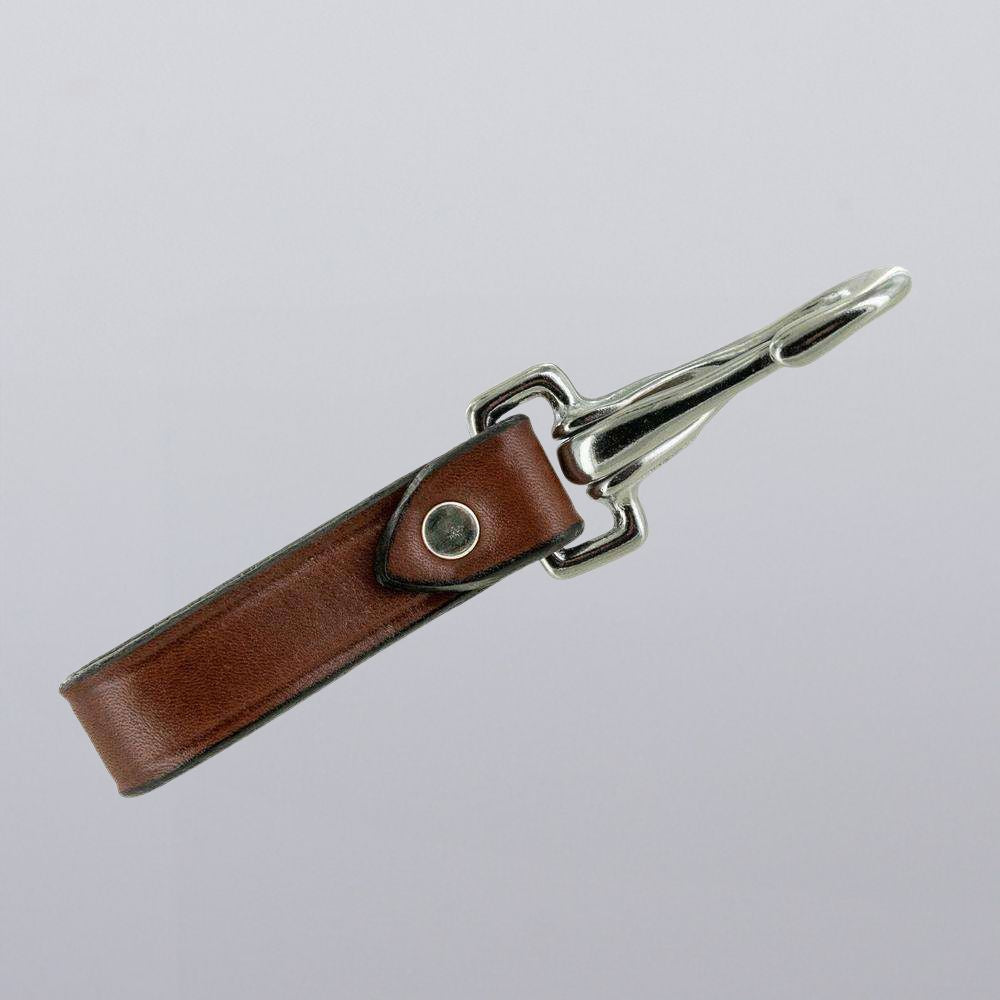 The Canyon Keychains by Hanks Belts feature a brown leather loop with a silver metal clasp, ideal for attaching to key fobs or belts, shown on a plain light gray background.
