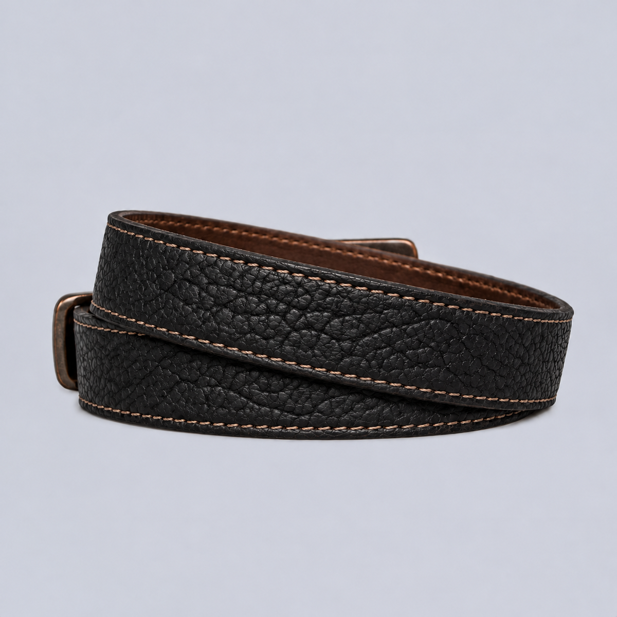 Hanks Belts The Yellowstone - 1.25″ black textured leather belt with contrast stitching, coiled on a light background.