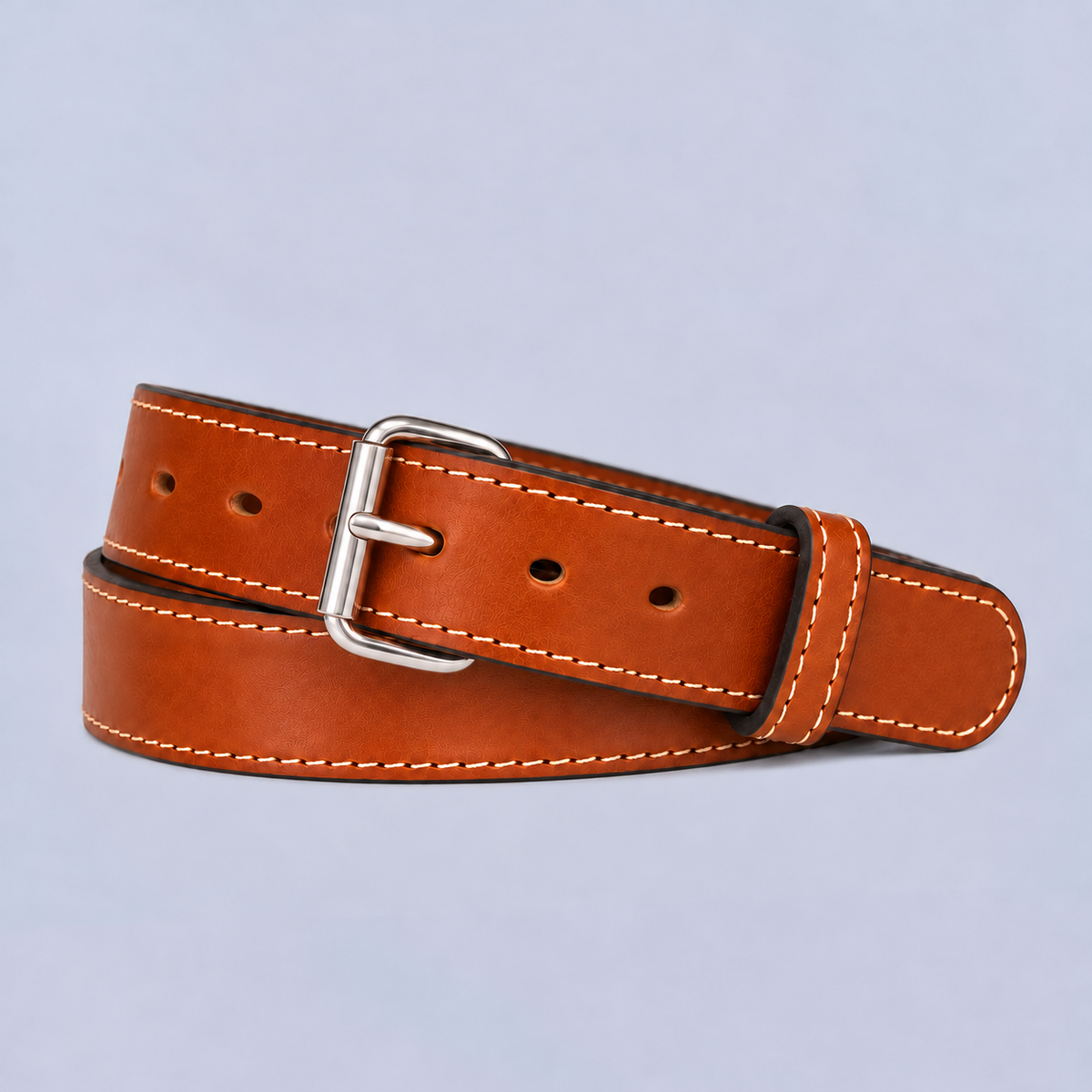 Coiled brown leather Hanks Belts The Xtreme - 1.5″ with white stitching and a silver buckle.
