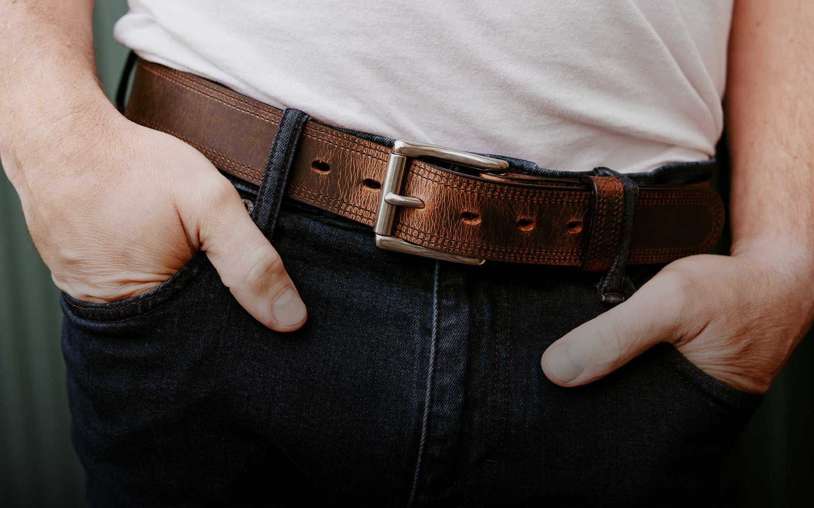Model wearing a gorgeous Hanks Bison Belt wearing a white tee and jeans