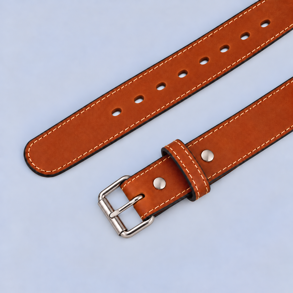 The Xtreme - 1.5″ heavy-duty brown leather belt with white stitching and a silver buckle.