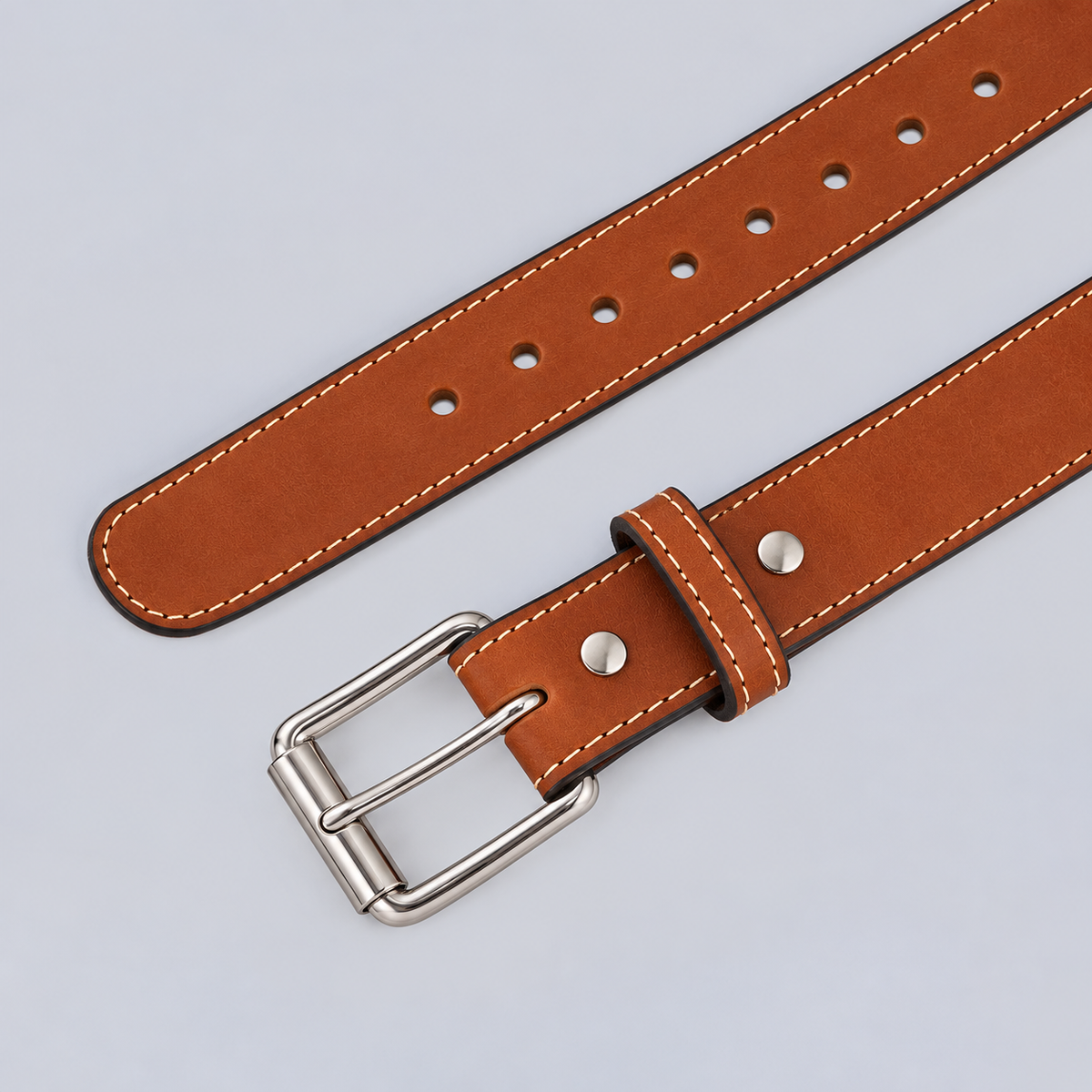 Hanks Belts The Xtreme - 1.5″ tan heavy duty leather belt with white stitching and a silver metal buckle.